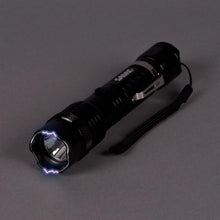 SABRE Tactical Stun Gun/LED Flashlight Delivers 1.139 microCoulombs/80 Lumens